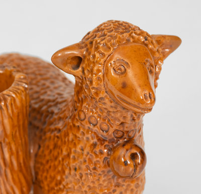 Rare Glazed Pennsylvania Redware Figure of a Sheep with Stump