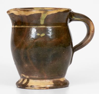 Multi-Glazed Redware Cream Pitcher, attributed to J. Eberly & Co., Strasburg, Virginia