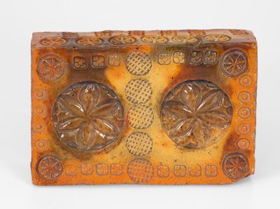 Rare Stamp-Decorated Redware Doorstop, PA origin, 19th century