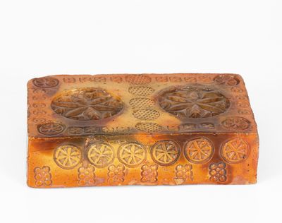 Rare Stamp-Decorated Redware Doorstop, PA origin, 19th century