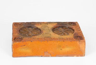 Rare Stamp-Decorated Redware Doorstop, PA origin, 19th century