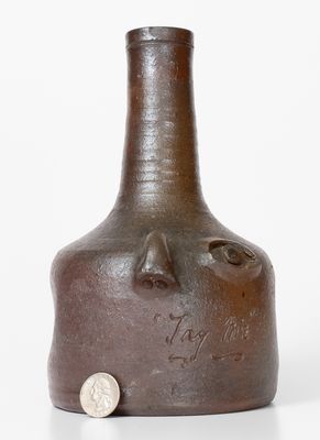 Rare Salt-Glazed Stoneware Face Bottle, Incised 