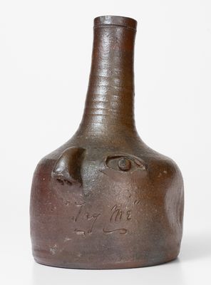 Rare Salt-Glazed Stoneware Face Bottle, Incised 