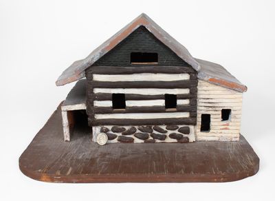 Painted Redware Sculpture of a Log Cabin, American, late 19th or 20th century