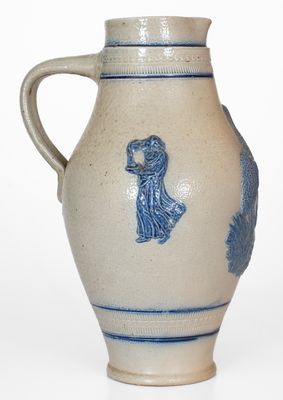 Cobalt-Decorated Stoneware Pitcher w/ Molded Stork and Human Motifs, attrib. White s Utica