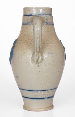 Cobalt-Decorated Stoneware Pitcher w/ Molded Stork and Human Motifs, attrib. White s Utica