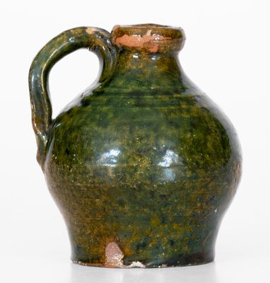 Fine Miniature Ovoid Massachusetts Redware Jug w/ Green Glaze, early 19th century