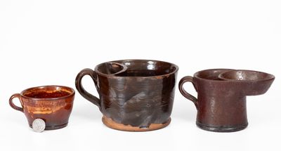 Lot of Three: Two Redware Shaving Mugs and Yellow Slip Decorated Redware Cup