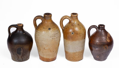 Four Small Stoneware Jugs w/ Dipped Slip, Northeastern U.S. origin, first quarter 19th century