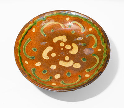 Exceedingly Rare Pennsylvania Redware Serving Dish w/ Two-Color Slip Decoration, 19th century