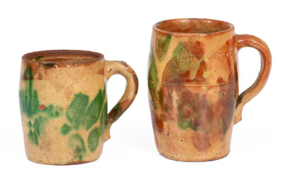 Two Multi-Glazed Redware Mugs, attributed to J. Eberly & Co., Strasburg, VA, c1890