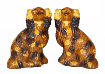 Pair of Pennsylvania Slip-Decorated Redware Spaniels