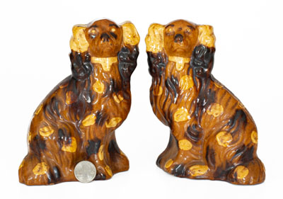 Scarce Pair of Slip-Decorated Pennsylvania Redware Spaniels, 19th century