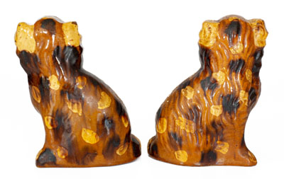 Scarce Pair of Slip-Decorated Pennsylvania Redware Spaniels, 19th century