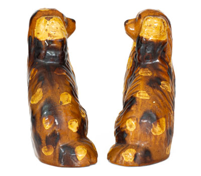 Scarce Pair of Slip-Decorated Pennsylvania Redware Spaniels, 19th century