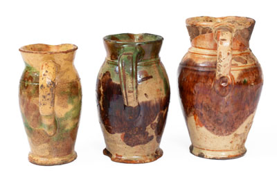 Three Multi-Glazed Redware Cream Pitchers, Bell or Eberly, Strasburg, VA