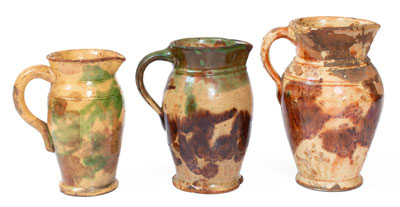 Three Multi-Glazed Redware Cream Pitchers, Bell or Eberly, Strasburg, VA