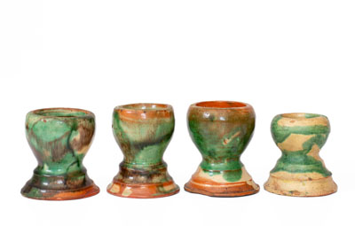 Four Shenandoah Valley Multi-Glazed Redware Egg Cups, Bell or Eberly, c1890