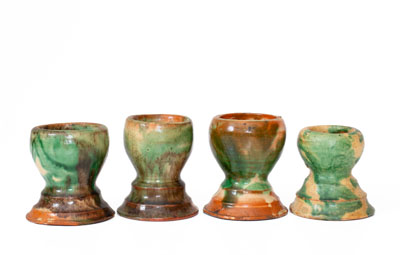 Four Shenandoah Valley Multi-Glazed Redware Egg Cups, Bell or Eberly, c1890