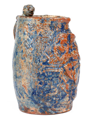 Unusual Cobalt Decorated Redware Pitcher w/ Relief Decoration and Figural Handle