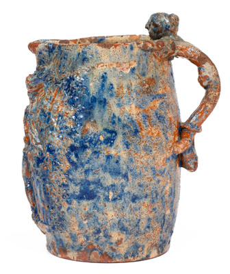 Unusual Cobalt Decorated Redware Pitcher w/ Relief Decoration and Figural Handle