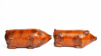 Rare Pair of Berks County, Pennsylvania Redware Pig Figures, 19th century