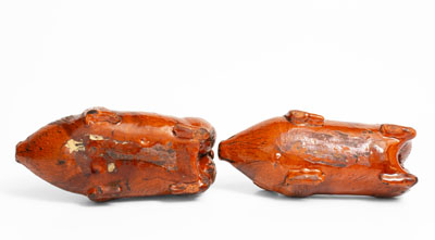 Rare Pair of Berks County, Pennsylvania Redware Pig Figures, 19th century