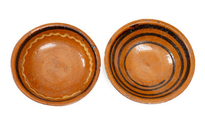 Two Small Slip-Decorated Redware Bowls, Mid-Atlantic or Southern origin, early to mid 19th century