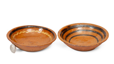 Two Small Slip-Decorated Redware Bowls, Mid-Atlantic or Southern origin, early to mid 19th century