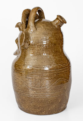 Outstanding and Important Alkaline-Glazed Alabama Stoneware Torso Jug, Inscribed 