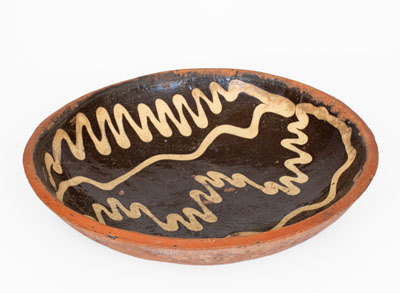 Slip-Decorated Redware Charger, English origin, 18th century