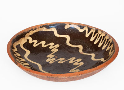 Slip-Decorated Redware Charger, English origin, 18th century