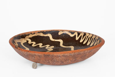 Slip-Decorated Redware Charger, English origin, 18th century