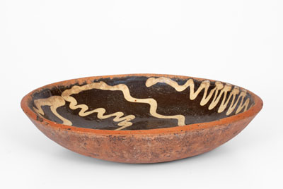 Slip-Decorated Redware Charger, English origin, 18th century