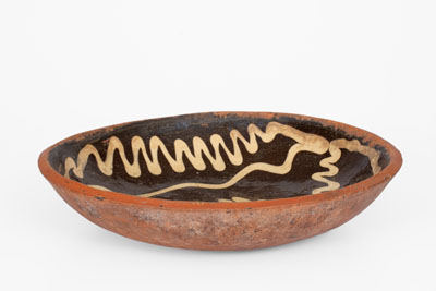 Slip-Decorated Redware Charger, English origin, 18th century