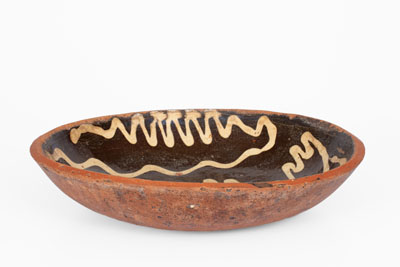 Slip-Decorated Redware Charger, English origin, 18th century