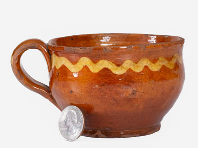 Extremely Rare Slip-Decorated Redware Cup, probably Charlestown, Massachusetts, 18th century