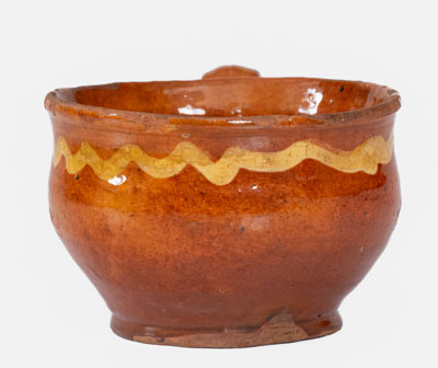 Extremely Rare Slip-Decorated Redware Cup, probably Charlestown, Massachusetts, 18th century