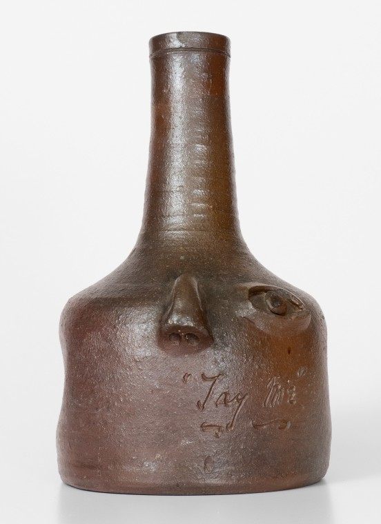 Rare Salt-Glazed Stoneware Face Bottle, Incised 