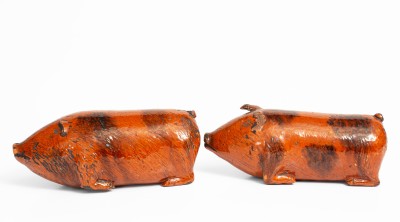 Rare Pair of Berks County, Pennsylvania Redware Pig Figures, 19th century