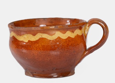 Extremely Rare Slip-Decorated Redware Cup, probably Charlestown, Massachusetts, 18th century